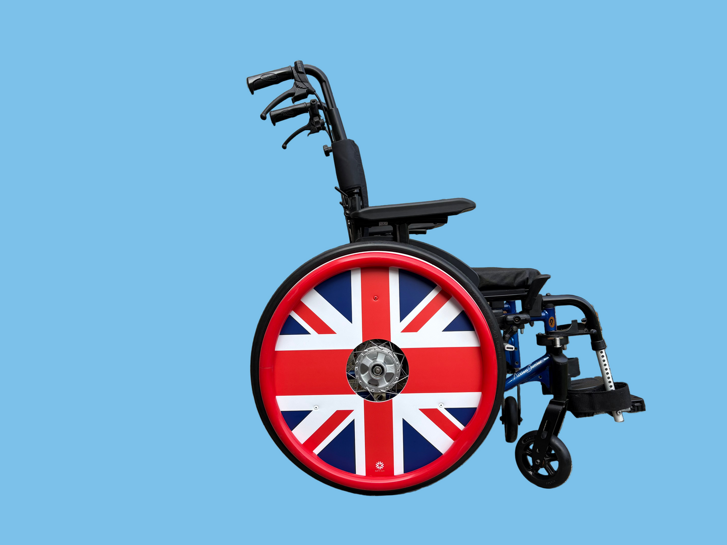 Wheelchair with bold Union Jack wheel cover design with a matching red silicone push rim cover.