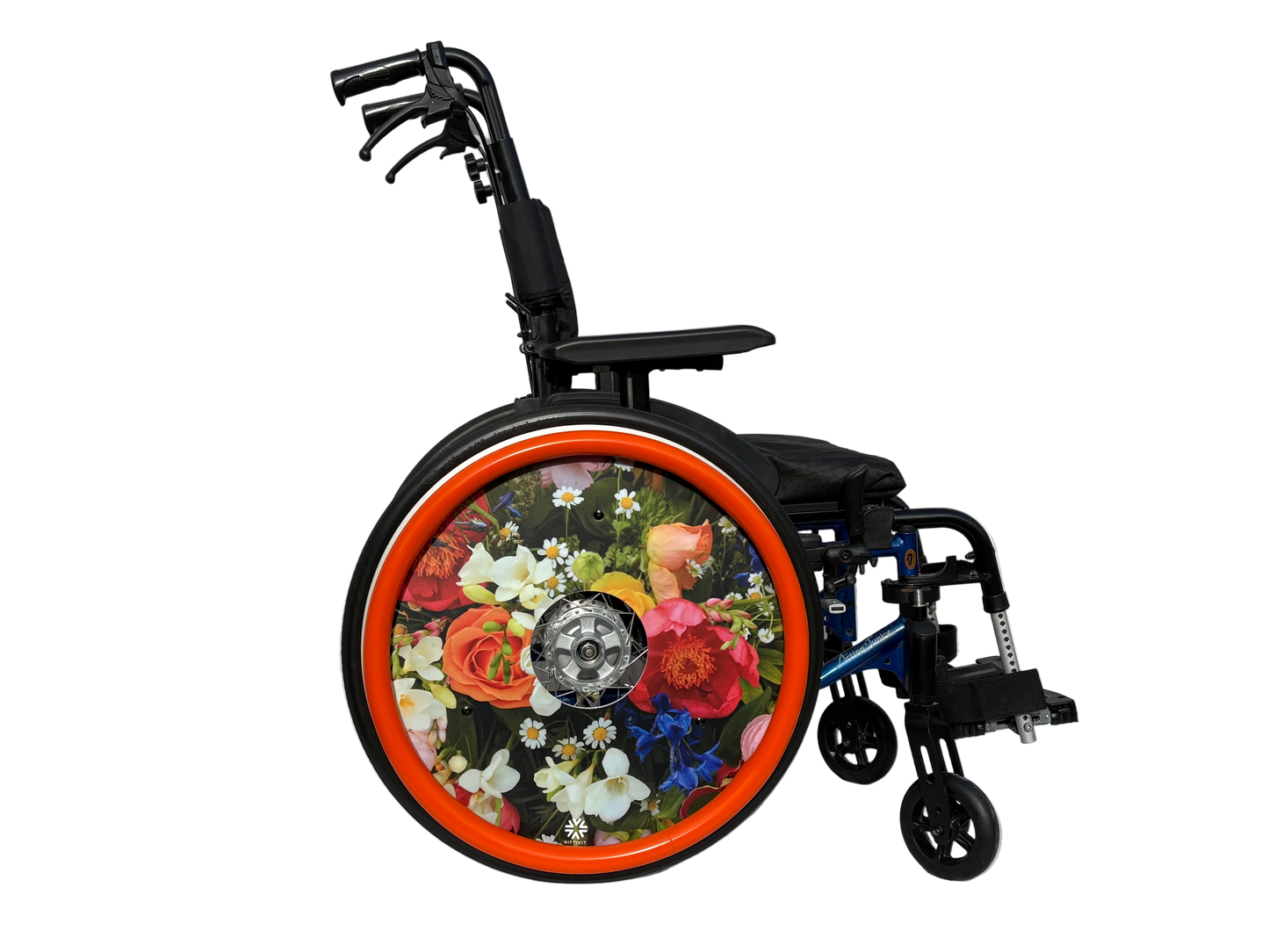 Wheelchair with spoke guard featuring colourful finished with a bright orange silicone hand rim cover for grip and comfort.