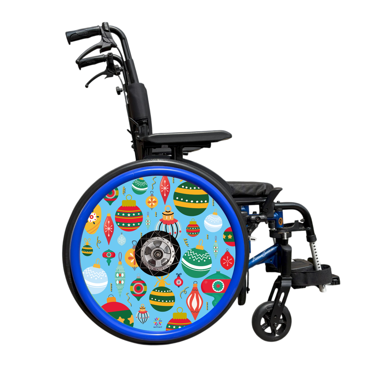Wheelchair showing wheel cover of colorful Christmas baubles on a blue background with blue push rim covers