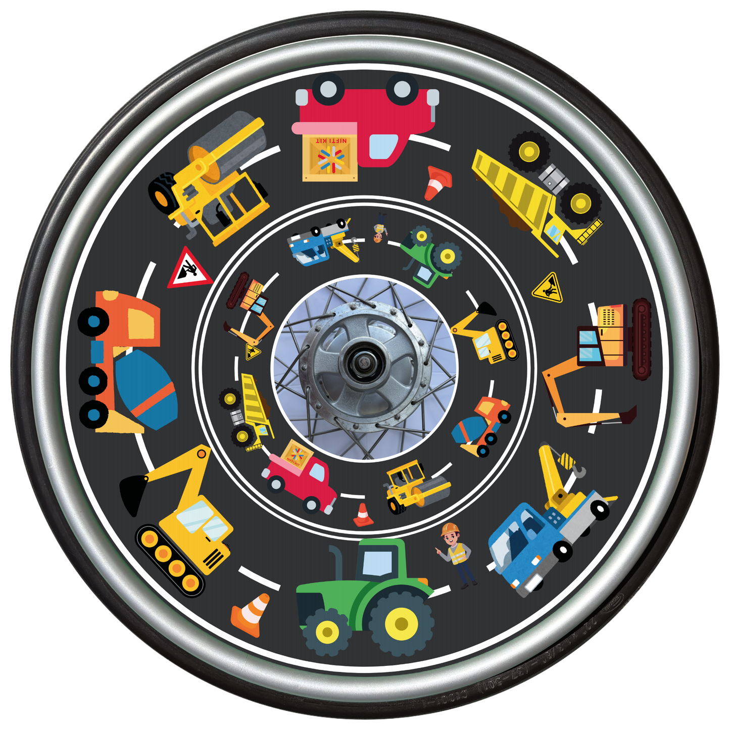 Wheelchair wheel with a colorful cover featuring tractors, diggers and and trucks designs and road background.