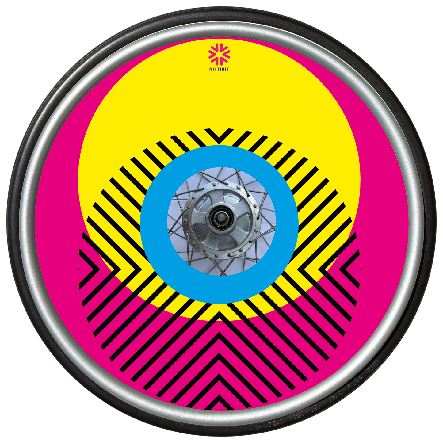 Wheelchair wheel with cover featuring bright geometric pattern including circles and lines. dark pink background with centre hub cutout and small Niftikit logo.