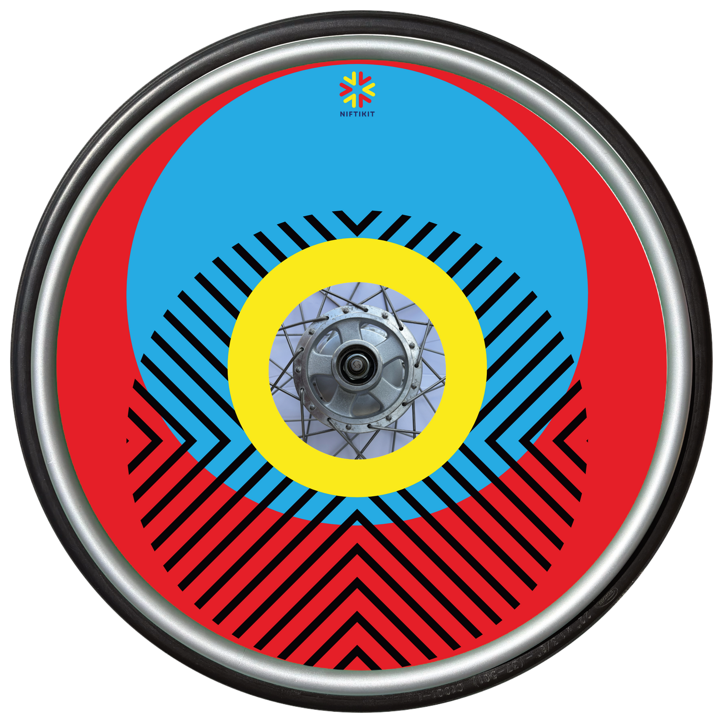 Wheelchair wheel with cover featuring bright geometric pattern including circles and lines. Red background with centre hub cutout and small Niftikit logo.