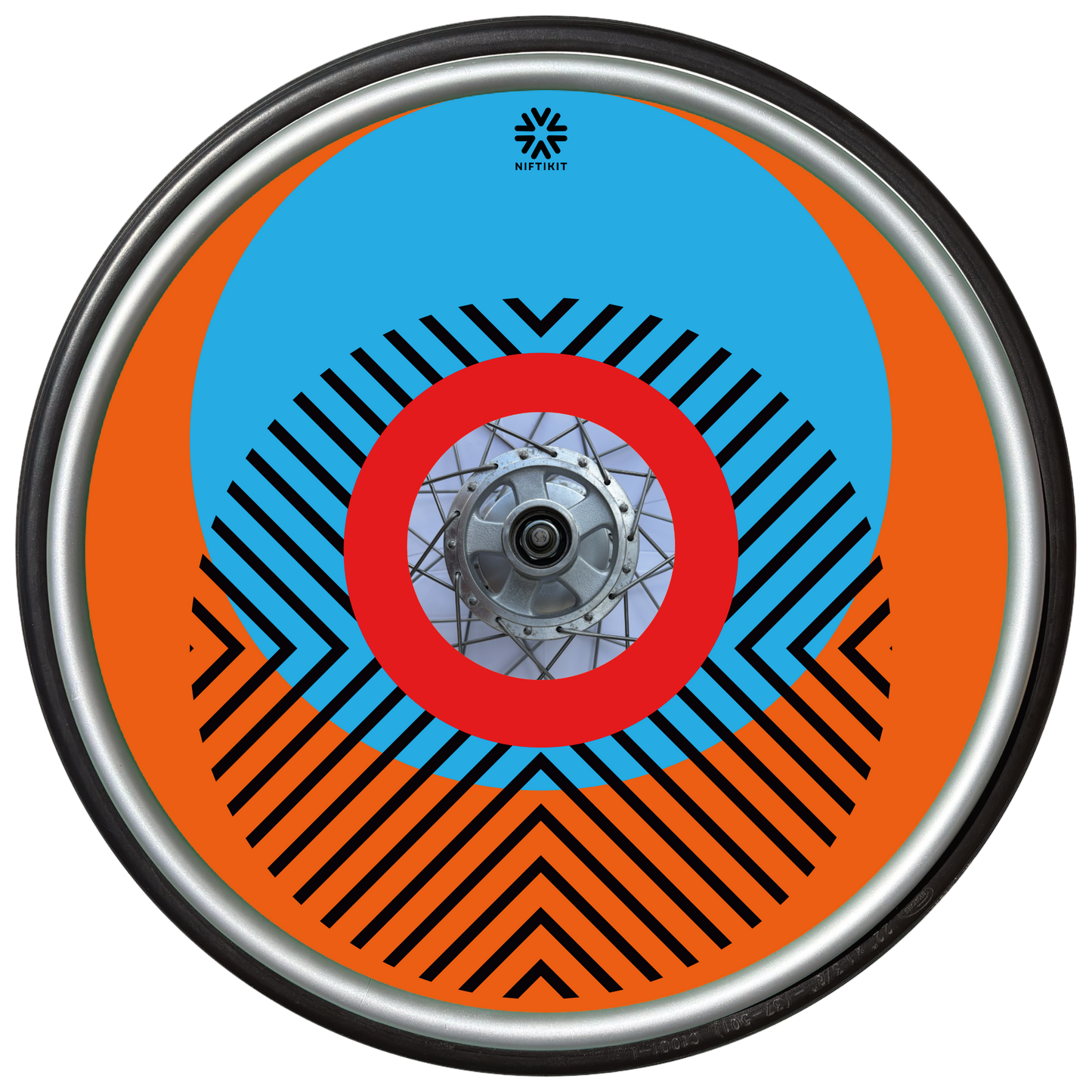 Wheelchair wheel with cover featuring bright geometric pattern including circles and lines. Orange background with centre hub cutout and small Niftikit logo.