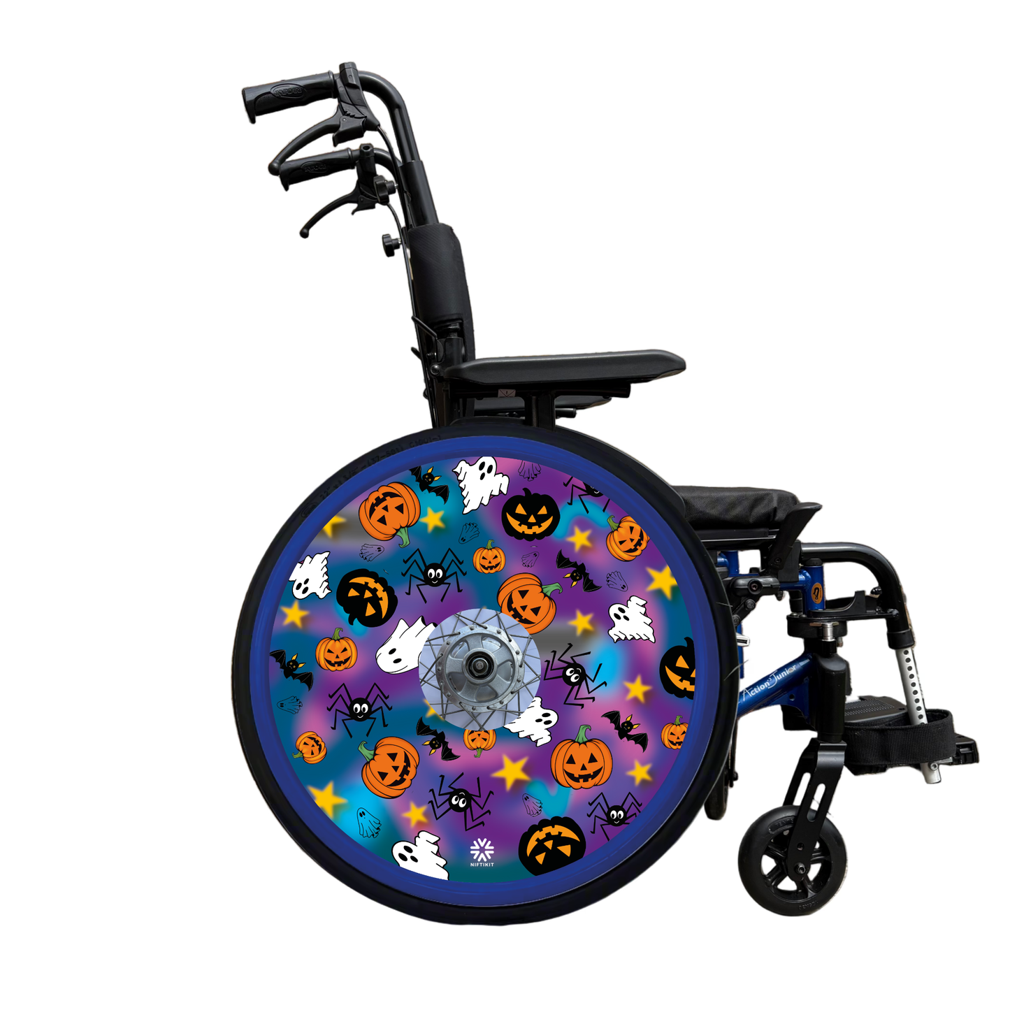 Wheelchair wheel cover on the wheelchair featuring spiders, ghosts, pumpkins and bats on a blue and purple background.