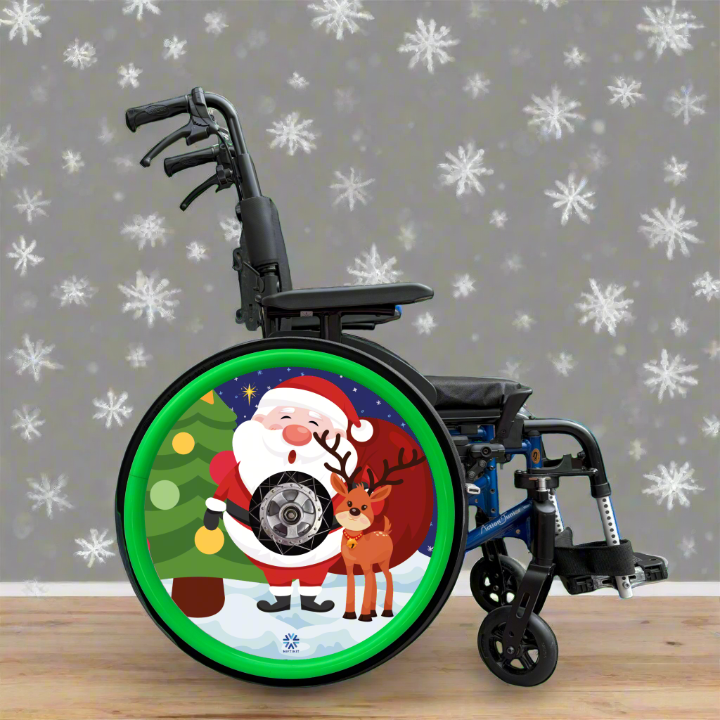 Wheelchair with a Christmas-themed wheel cover featuring colourful Santa Claus and a reindeer on a snowy background finished with green silicone Handrim covers.