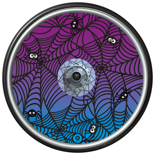 Wheelchair wheel cover on a wheel featuring spiders on spider webs on an purple background.