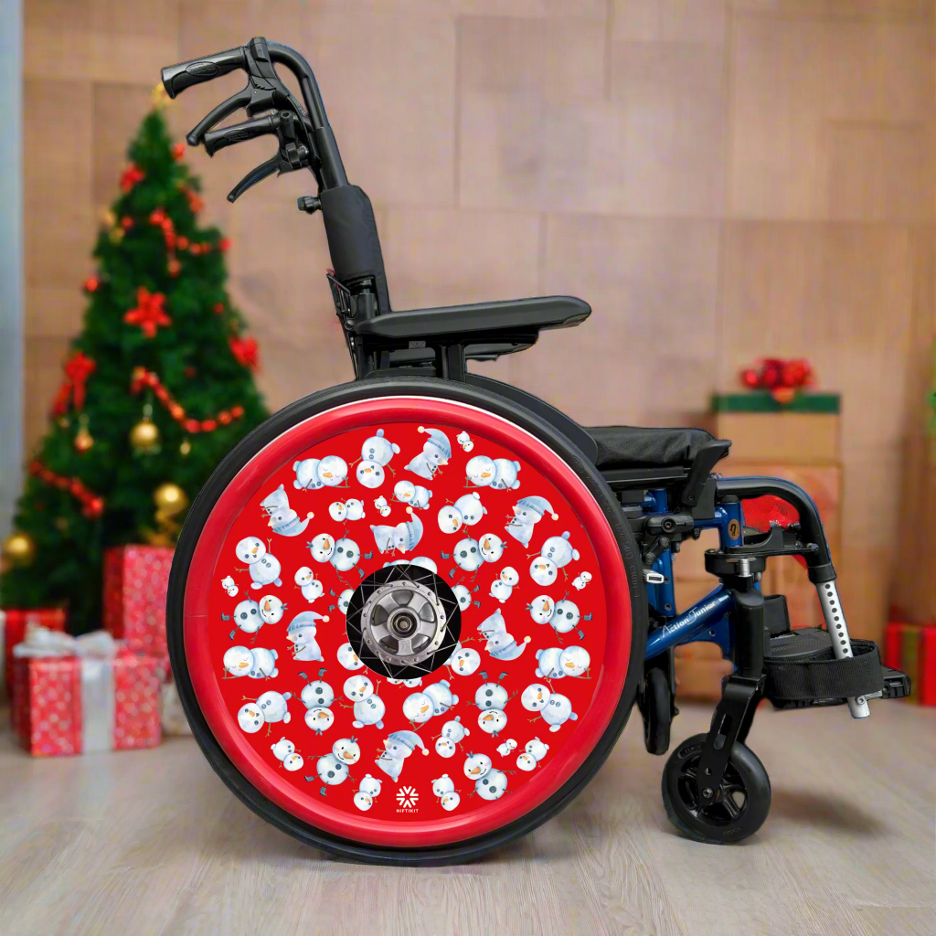 Wheelchair with spoke guard featuring multiple snowman pattern on a red background and matching red push rim cover.