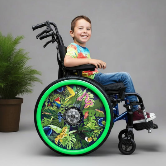 Child in a wheelchair with colourful, tropical, wheelchair wheelcovers featuring plants and animals.”