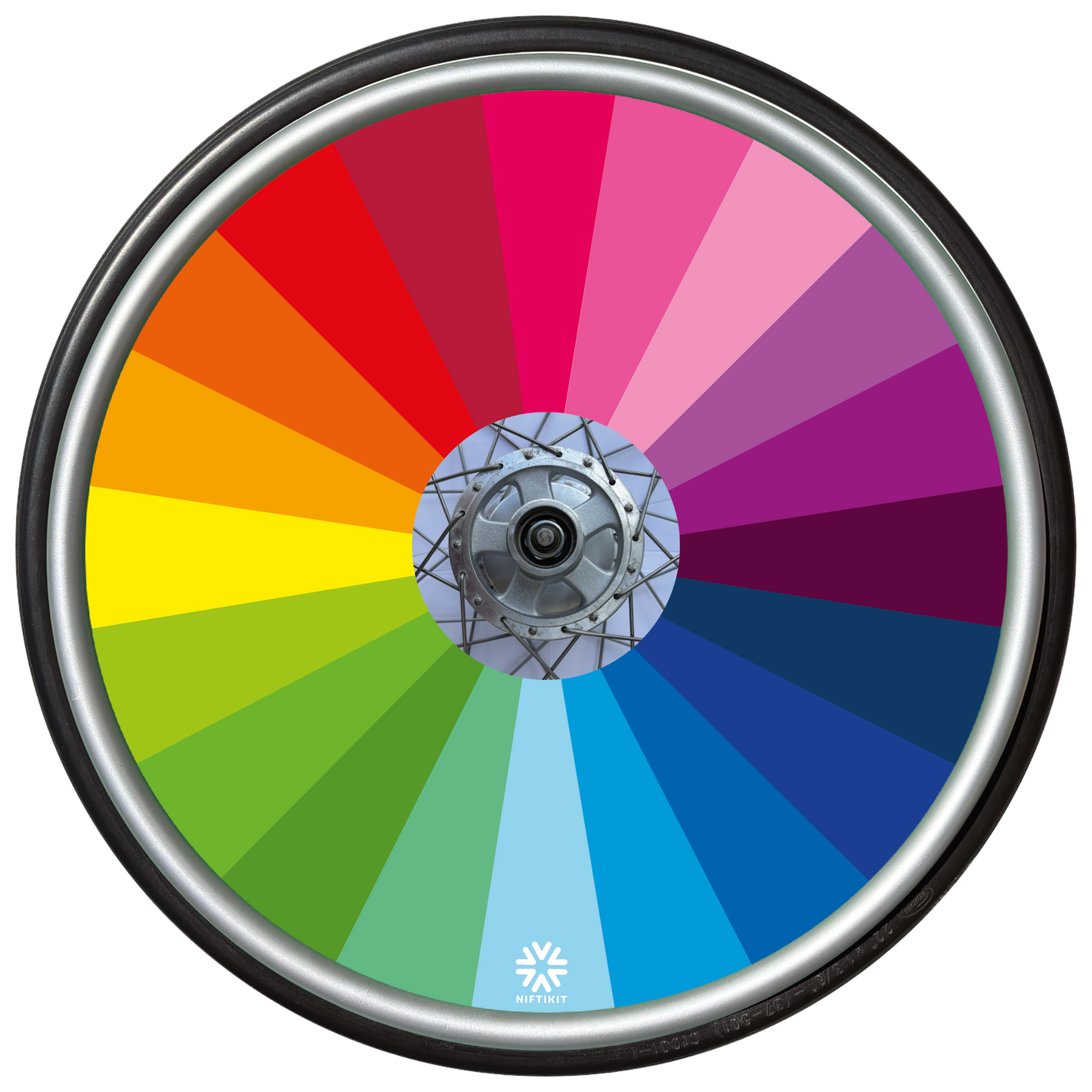 Wheelchair wheel featuring a spoke guard cover with rainbow colour spectrum fanning out from the centre.