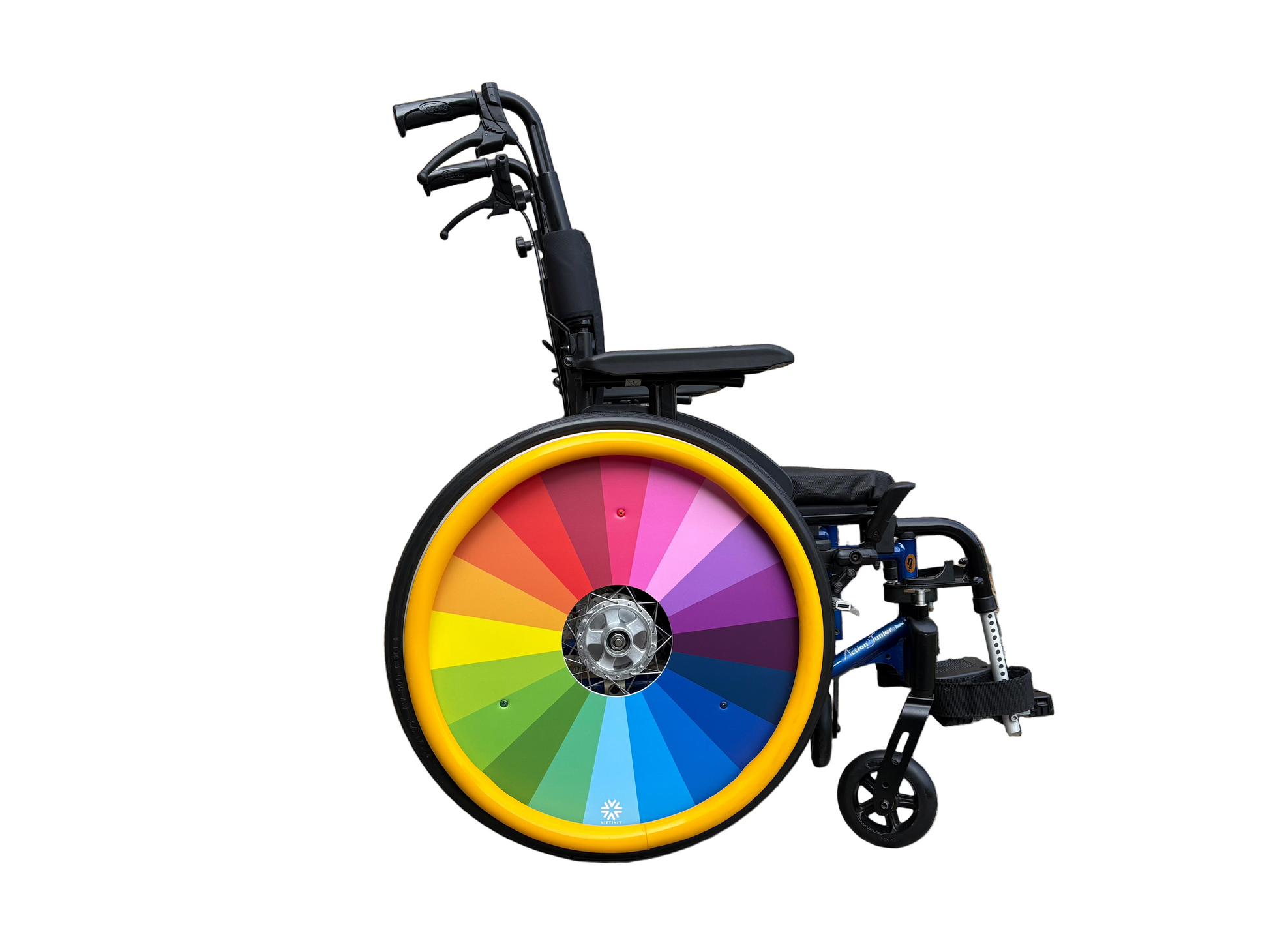 Wheelchair featuring a spoke guard cover with rainbow colour spectrum fanning out from the center. Includes hole for wheel hub.