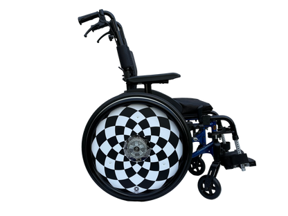 Wheelchair with wheel guard  featuring black and white geometric pattern, finished with a sleek black silicone hand rim cover for grip and comfort.