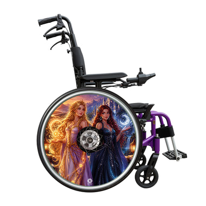 Princess Fantasy wheelchair wheel cover fitted to a wheelchair wheel, featuring two fantasy princesses, a castle, mountains and a magical golden and blue landscape
