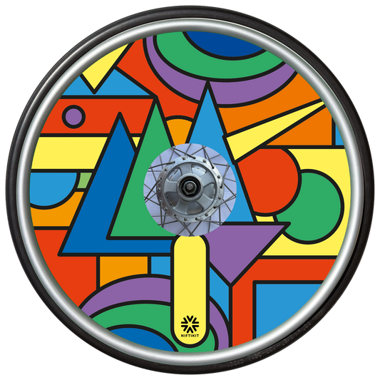Wheelchair wheel with colorful bold geometric shapes spoke guard cover in bright colours. Small black Niftikit logo.