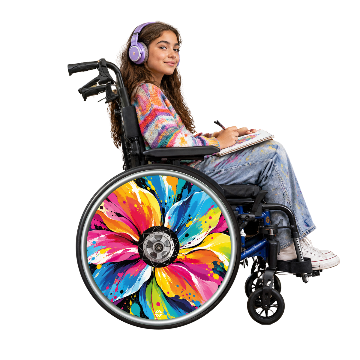 Wheelchair user with Abstract Flower Pop floral wheelchair spoke guards featuring bright, colourful abstract artwork.