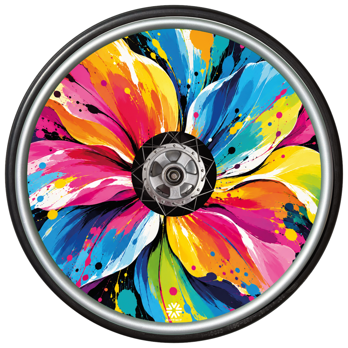 Abstract Flower Pop wheelchair spoke guard fitted inside a wheelchair wheel, displaying vibrant floral artwork with bold colours and paint-splatter details.