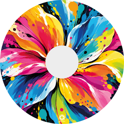 Abstract Flower Pop colourful abstract flower design for Niftikit wheelchair wheel covers, featuring vibrant pink, blue, yellow and orange paint splashes.
