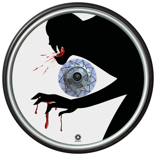 Wheelchair wheel cover on a wheel, featuring the silhouette of a monster with blood on mouth and hands on a  white background. 