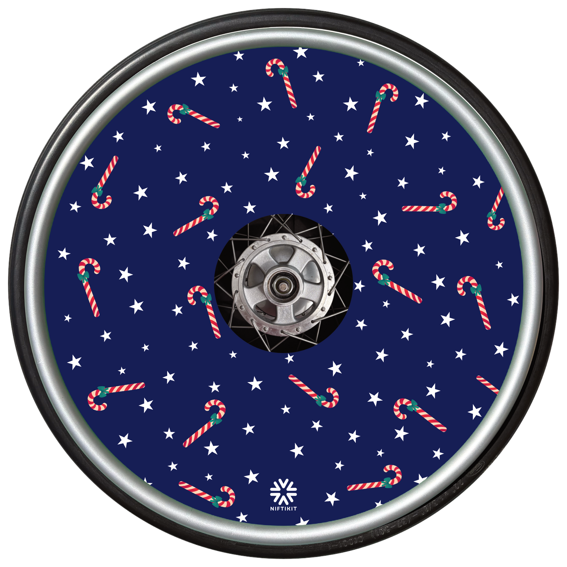 Decorative wheel cover with candy cane and star pattern on a blue background