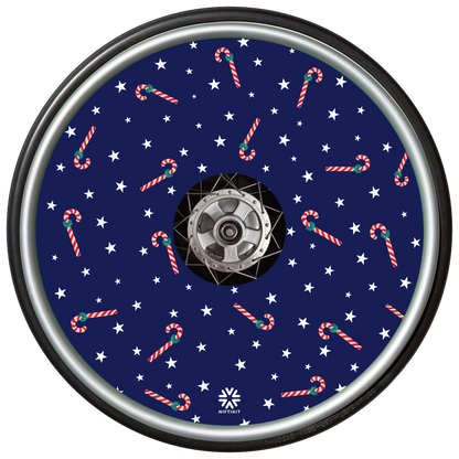 Decorative wheel cover with candy cane and star pattern on a blue background