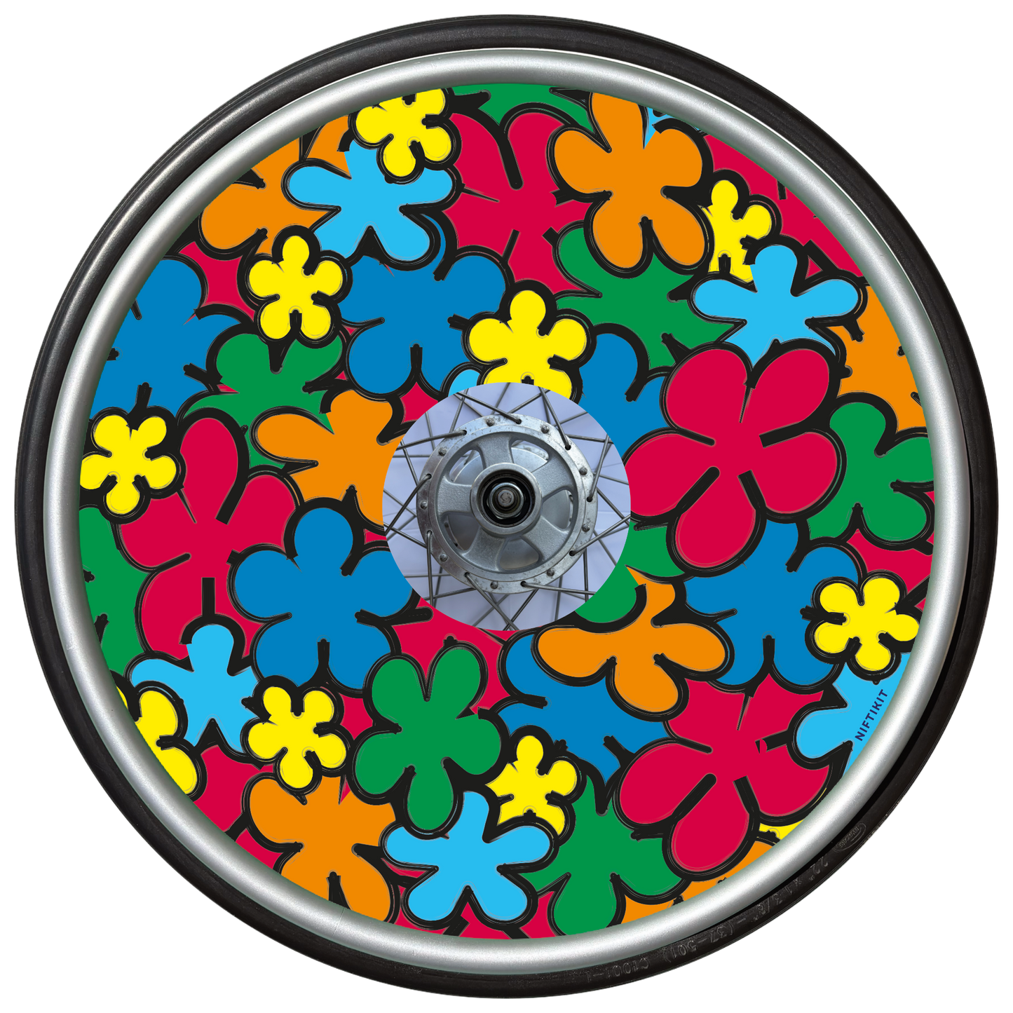 Wheelchair wheel with a colorful, cartoon flowers spoke guard cover in red, orange, green, yellow and blue.