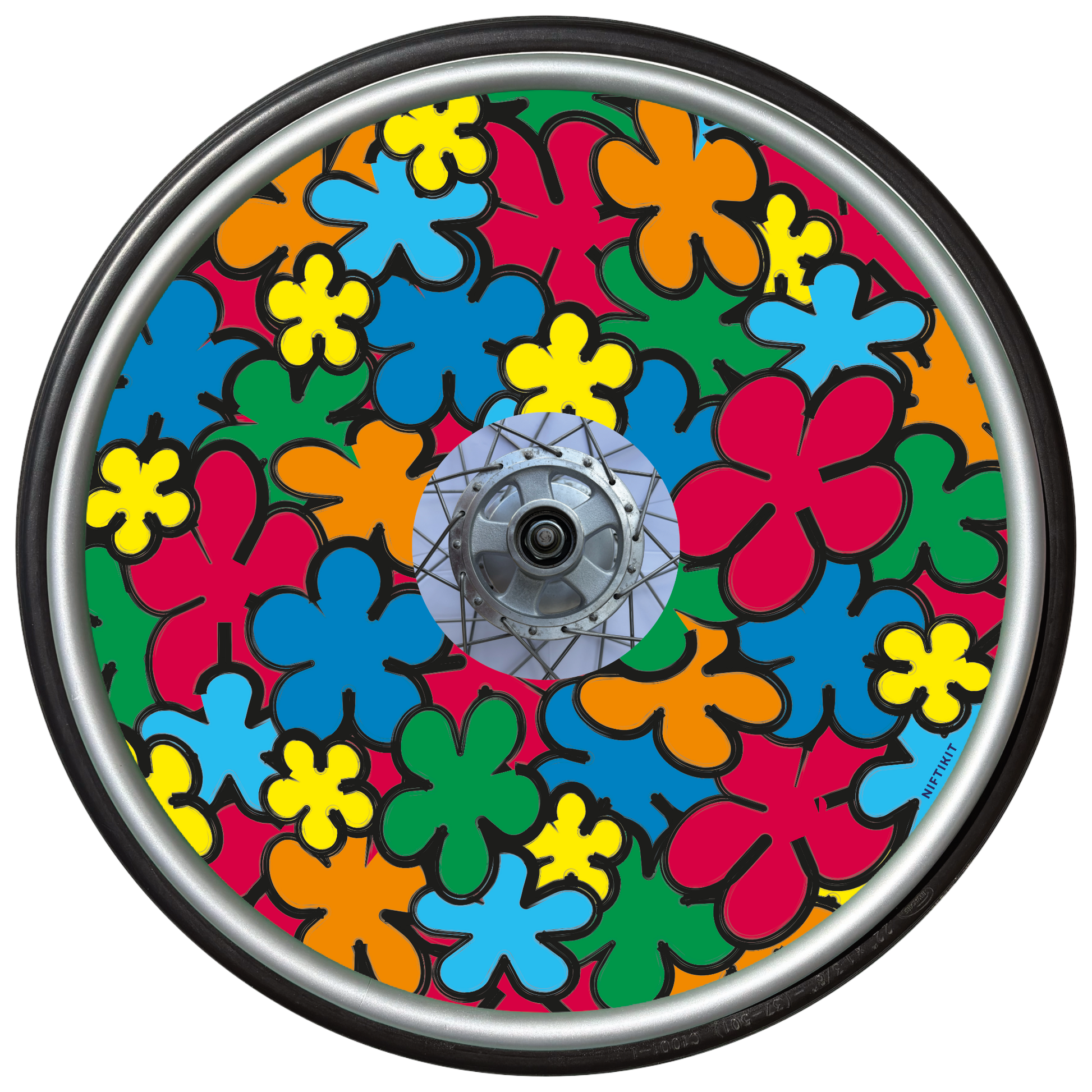 Wheelchair wheel with a colorful, cartoon flowers spoke guard cover in red, orange, green, yellow and blue.