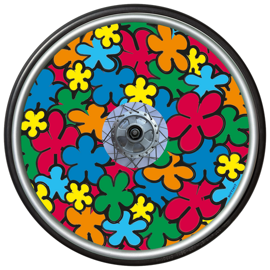 Wheelchair wheel with a colorful, cartoon flowers spoke guard cover in red, orange, green, yellow and blue.