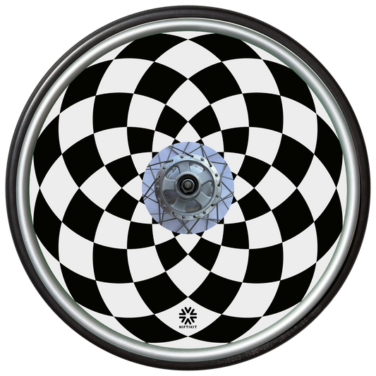Checkered wheelchair wheel cover with black and white diamonds  pattern and small black Niftikit logo. 