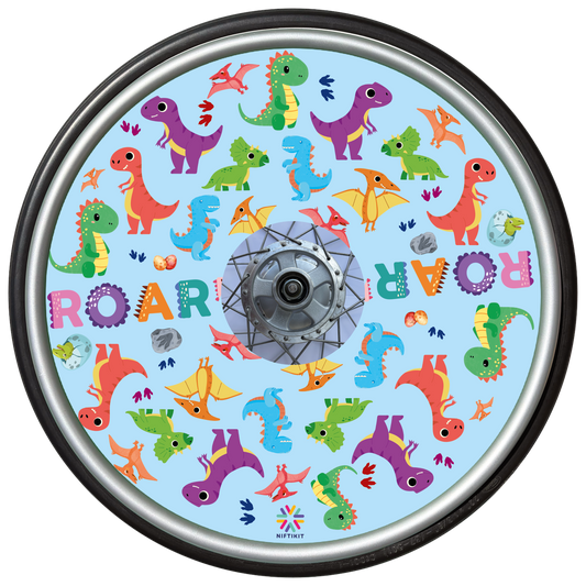 Wheelchair wheel featuring a wheel cover with colorful dinosaur pattern on a blue background