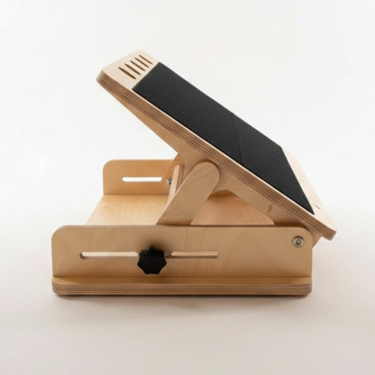 Accessible wooden desk frame with non-slip pads and adjustable side bolts. Shelf removed. against white background. 