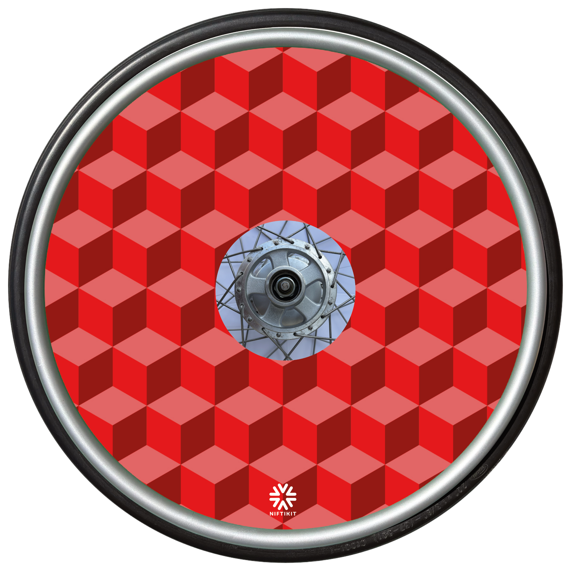 Wheelchair wheel with red geometric-bricks patterned spoke guard cover with a small white visible Niftikit logo.
