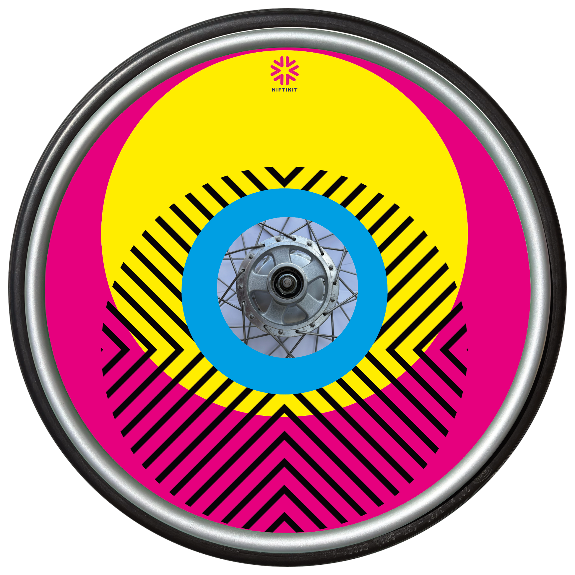 Wheelchair wheel with cover featuring bright geometric pattern including circles and lines. dark pink background with centre hub cutout and small Niftikit logo.
