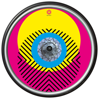 Wheelchair wheel with cover featuring bright geometric pattern including circles and lines. dark pink background with centre hub cutout and small Niftikit logo.