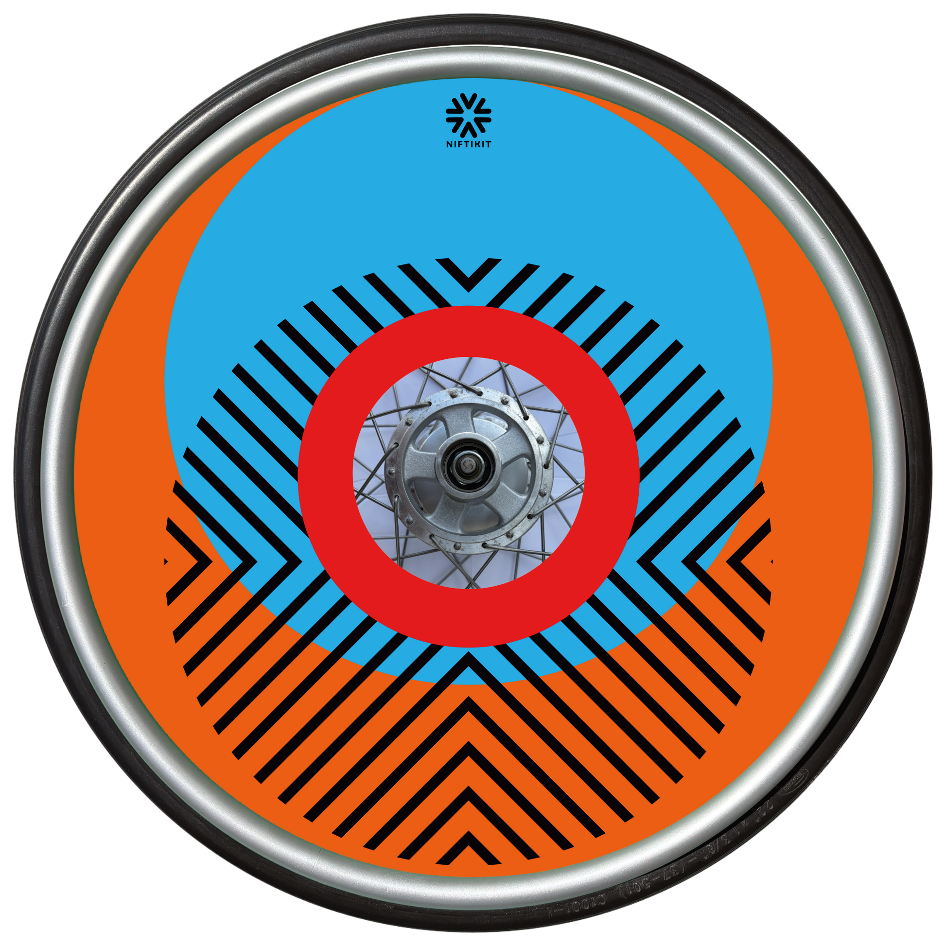 Wheelchair wheel with cover featuring bright geometric pattern including circles and lines. Orange background with centre hub cutout and small Niftikit logo.