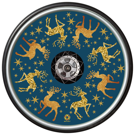Wheelchair wheel with spoke guard  featuring sparkly golden reindeer running around the circumference 