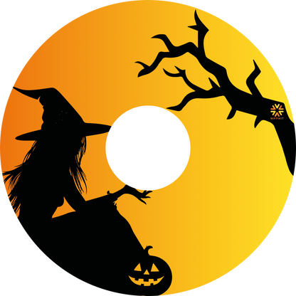 Wheelchair wheel cover featuring the silhouette of a witch and tree on an orange background