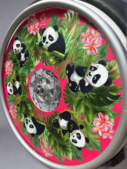 Angled wheelchair wheel with cover featuring cute panda illustrations, flowers, and leaves on a pink  background