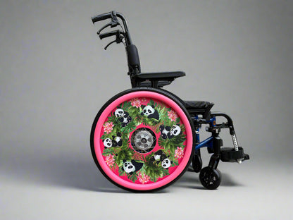 Wheelchair with spoke guard featuring cute panda illustrations, flowers, and leaves on a pink background with matching pink hand rim covers. 
