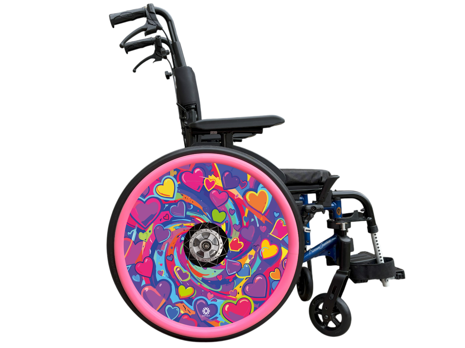 A bright love heart themed swirling design in pinks, purples, yellows and greens. This wheel cover is displayed on a wheelchair with pink silicone hand rim covers (sold separately). 