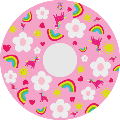 Wheelchair wheel cover with bright rainbows and unicorns on a baby pink background with cartoon white flowers. 