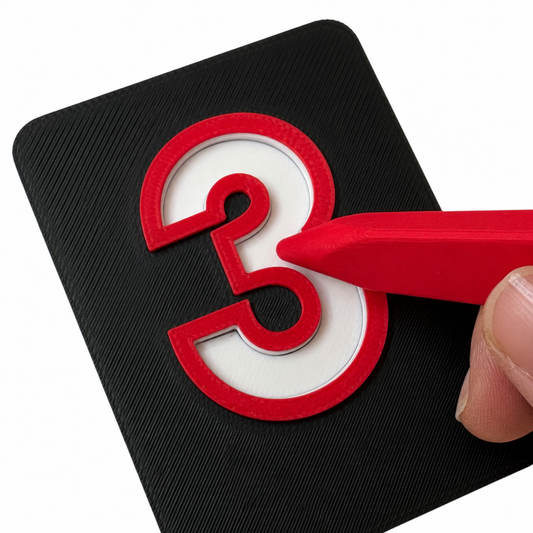 3 — Nifti-Vision high contrast tactile number tile showing the raised number 3 with an internal channel for tactile tracing and number formation practice with easy grip play pen.