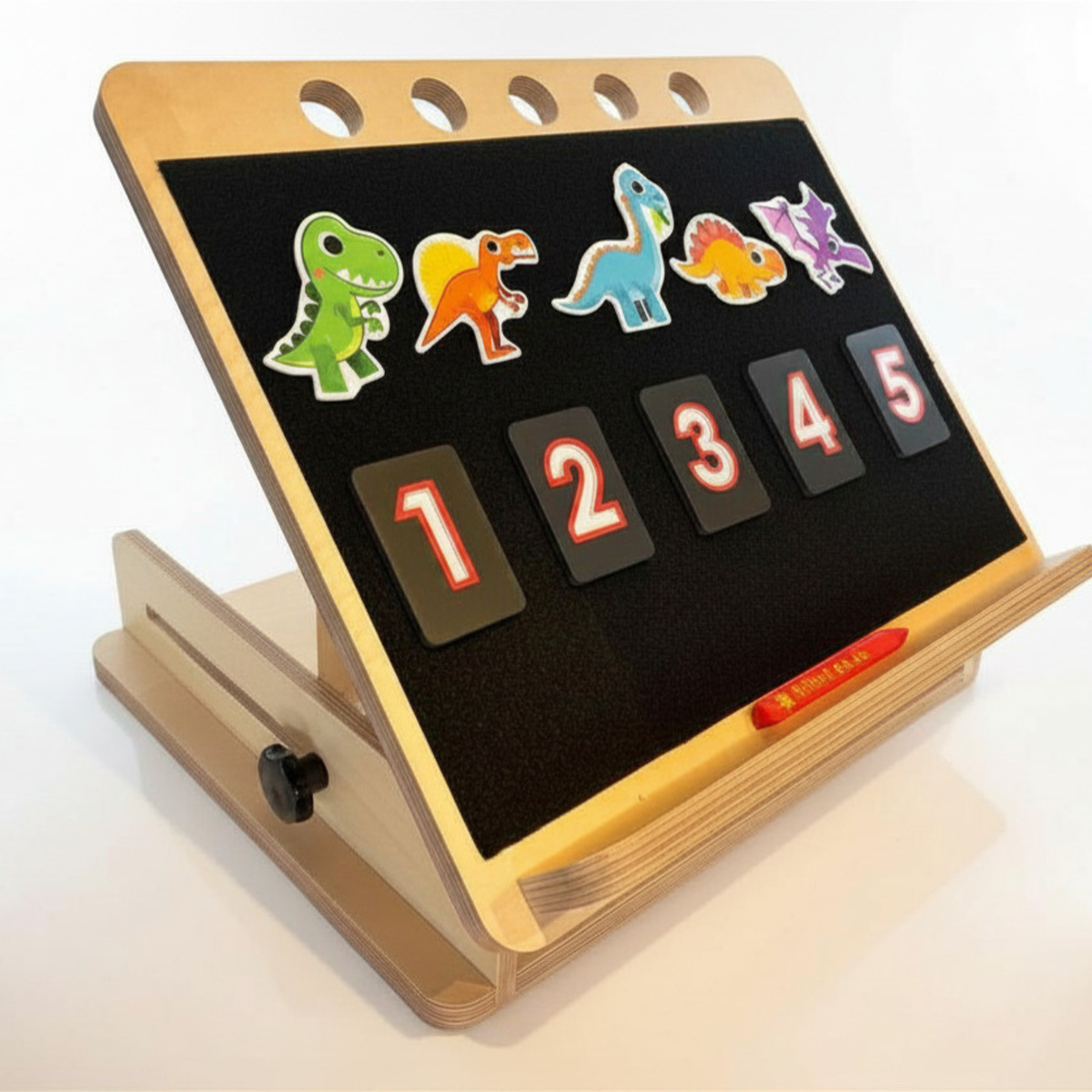 Nifti-Vision high contrast tactile number tiles displayed on a desk slope, demonstrating how the tiles can be positioned for accessible tactile number learning and tracing activities.