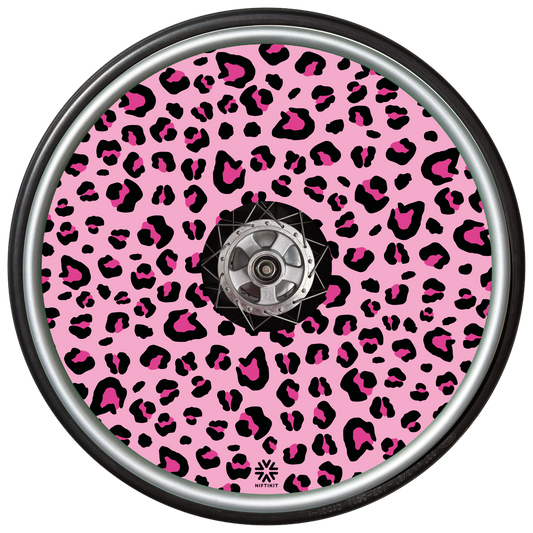 Pink Wheelchair Spoke Guard with black and pink leopard print pattern on a light pink background . Includes a small Niftikit logo in black at the bottom 