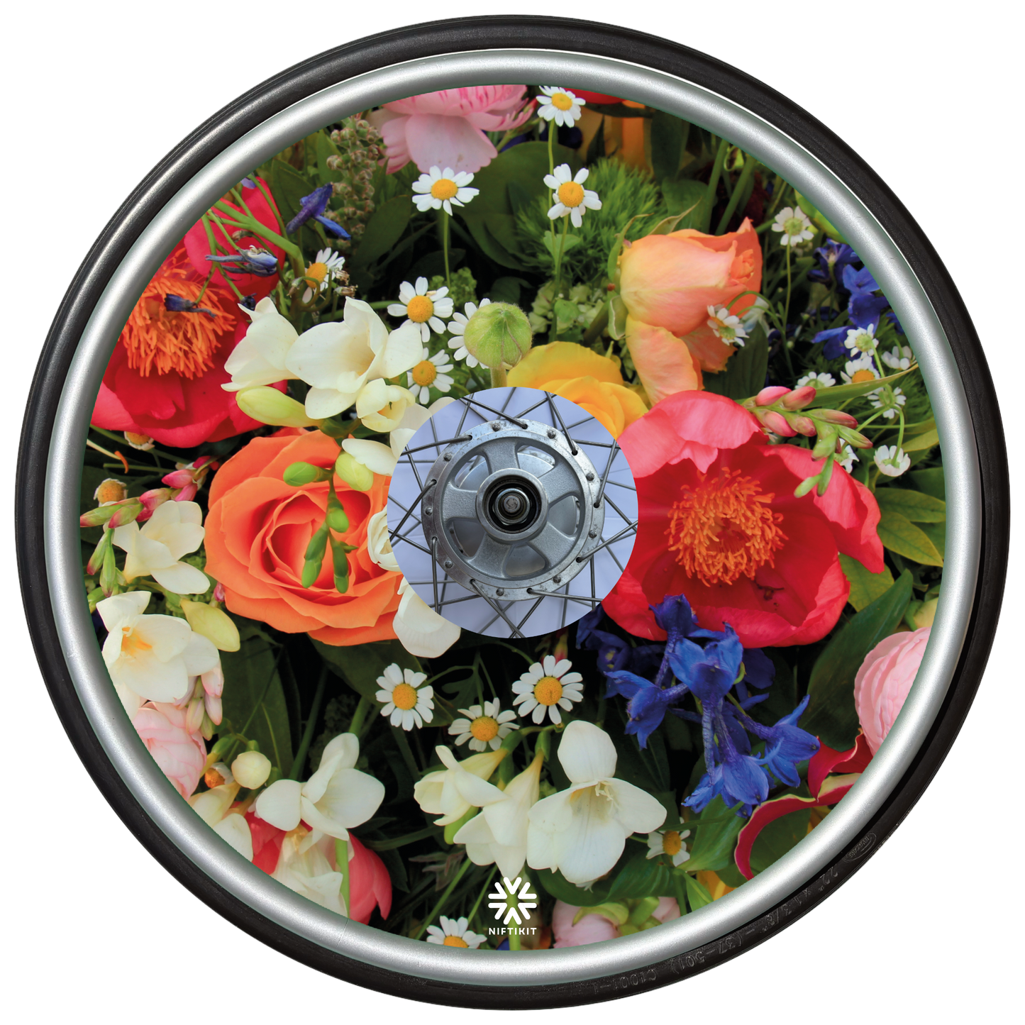 Wheelchair wheel featuring a wheel cover with a enlarged photo of vibrant British flowers including roses, bluebells, daisy's and mixed foliage.  