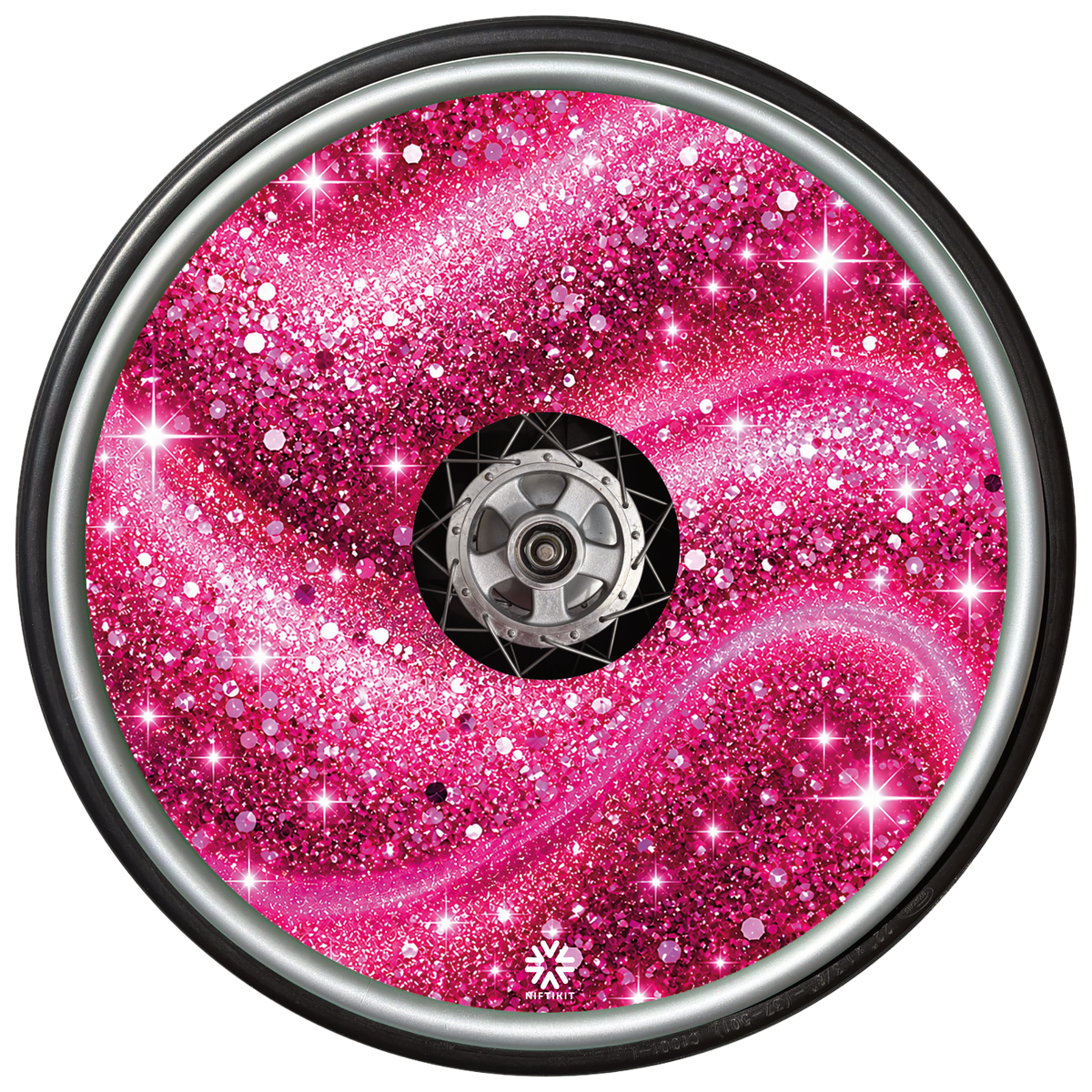 Pink Stardust wheel cover fitted to a wheelchair wheel.