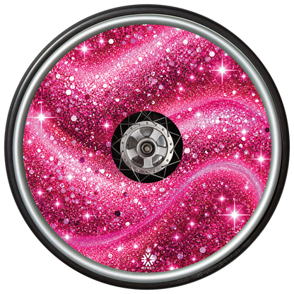 Pink Stardust wheel cover fitted to a wheelchair wheel.