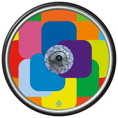 Bright and colorful geometric, squares patterned wheel cover on a wheel chair wheel with small blue Niftikit logo. 