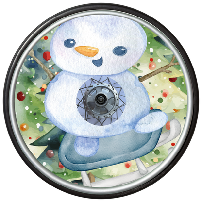 Decorative wheelchair wheel with spoke cover featuring a snowman design on a watercolour Christmas Tree background