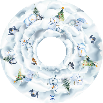 Wheelchair wheel cover with winter, snow-themed design featuring snowmen and penguins.