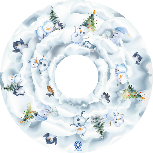 Wheelchair wheel cover with winter, snow-themed design featuring snowmen and penguins.