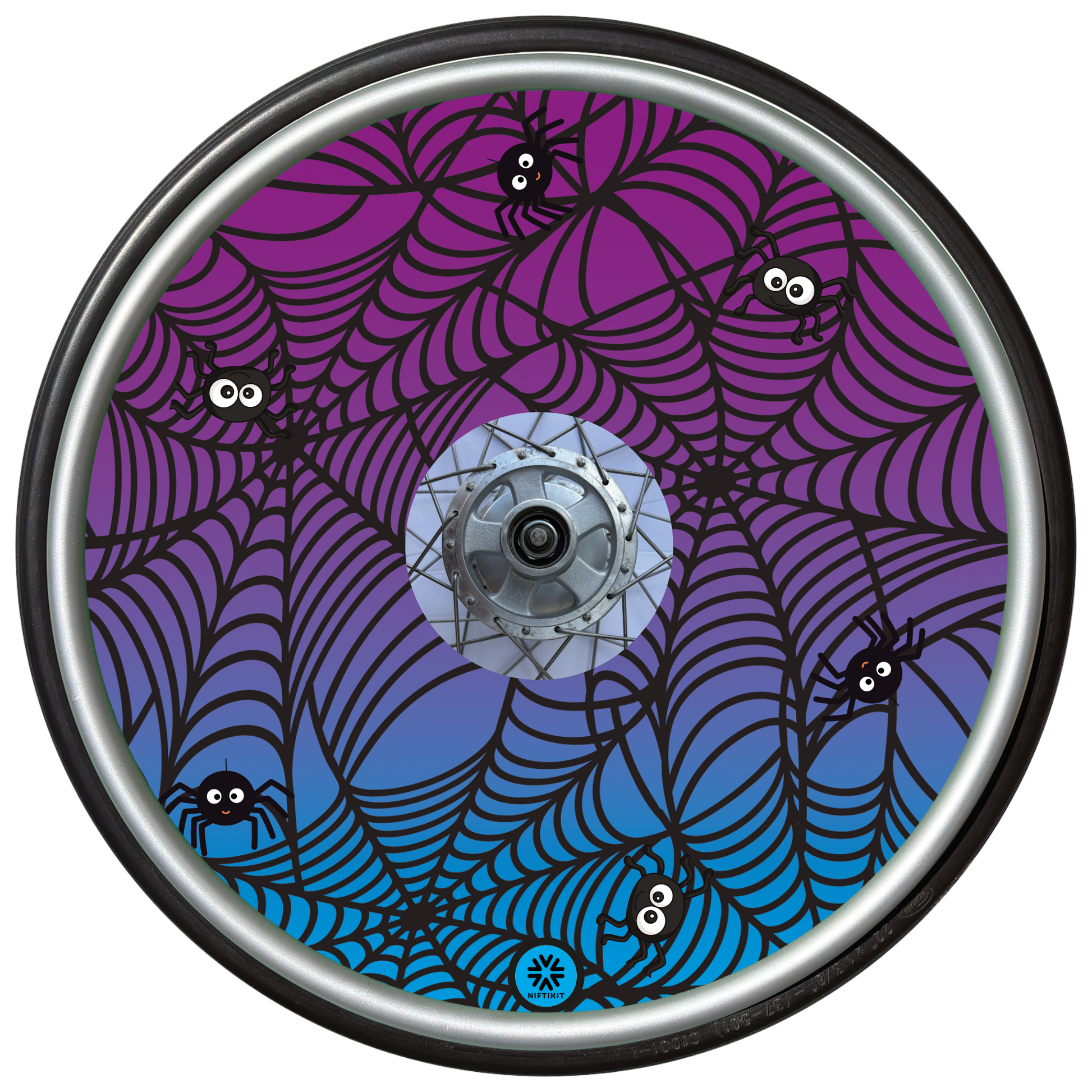 Wheelchair wheel cover on a wheel featuring spiders on spider webs on an purple background.